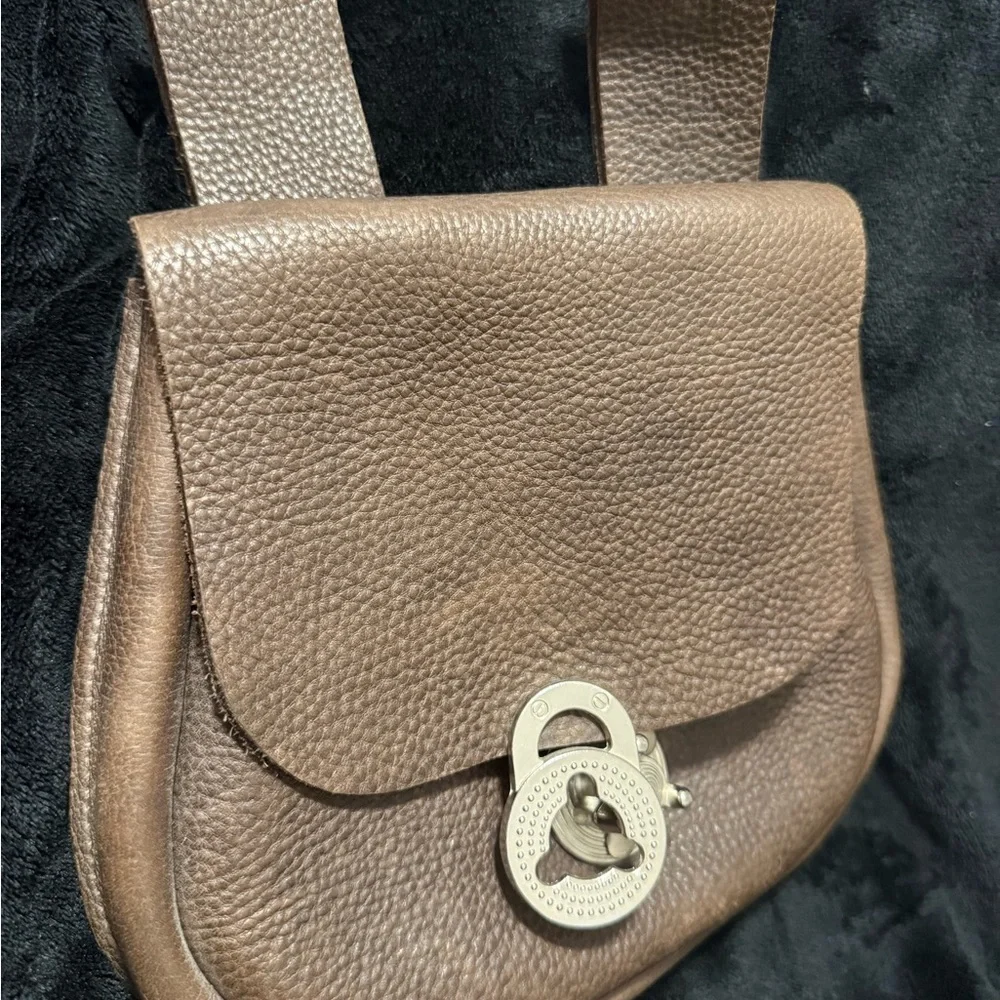 Brown Leather Backpack with Classic Design and Flap Closure